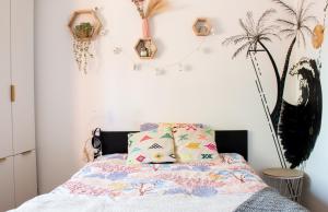 a bedroom with a bed with two pillows on it at Maison Route de l'Océan in Sainte-Hélène +20 photos