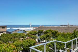 a view of the ocean from the balcony of a condo at Loki's Kingdom in Rockaway Beach +43 photos