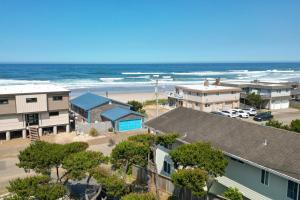 an aerial view of a beach with houses and the ocean at Loki's Kingdom in Rockaway Beach
