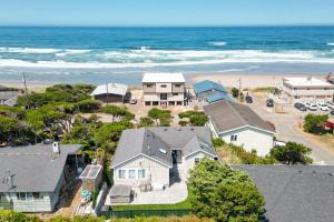 an aerial view of a house and the beach at Loki's Kingdom in Rockaway Beach
