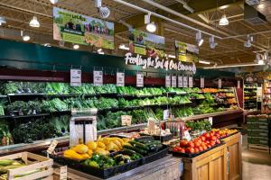 a produce section of a grocery store with fruits and vegetables at Charming Duplex Retreat in Old Town Manchester, VA in Richmond