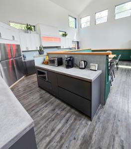 a kitchen with a counter top with a coffee maker at Copper Rose Retreat B&B in Invermere