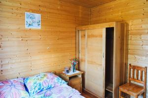 Postel nebo postele na pokoji v ubytování Domki Letniskowe Zygmunt