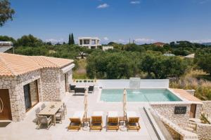 a villa with a swimming pool and a house at Angel Villa Zante in Lithakia +26 photos