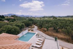 an aerial view of a house with a swimming pool at Angel Villa Zante in Lithakia