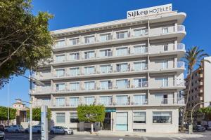 a large white building with a sign on it at Silken Turcosa 3 Sup in Castellón de la Plana