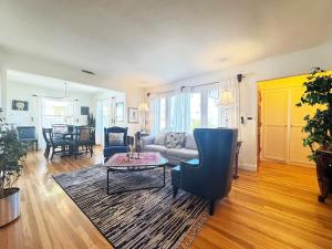 a living room with a couch and a table at Charming 3BR House - Hal-UC in Los Angeles