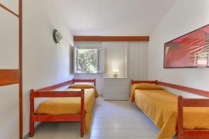 A bed or beds in a room at Villa Montecristo