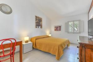 A bed or beds in a room at Villa Montecristo