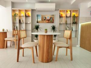 a table and chairs in a waiting room at Karden Otel in Antalya