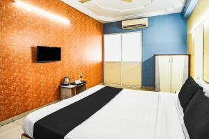 Postel nebo postele na pokoji v ubytování Super Hotel O Vibrant Residency