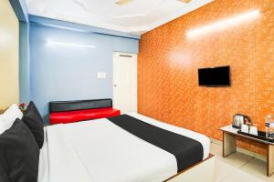 Postel nebo postele na pokoji v ubytování Super Hotel O Vibrant Residency + 26 fotografií