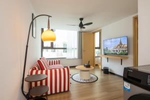 TV a/nebo společenská místnost v ubytování Amanda Hotel堆谷里酒店
