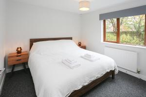 Ένα ή περισσότερα κρεβάτια σε δωμάτιο στο Newly refurbished! Eastside Escape - Conveniently located with fantastic local transport links +20 φωτογραφίες