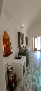 a kitchen with a sink and a counter top at Aliori art caves in Aegiali