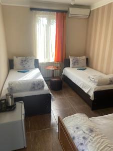 Voodi või voodid majutusasutuse Zangu Hotel toas