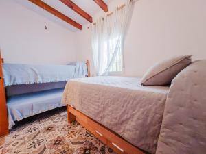 A bed or beds in a room at Cortijo Vélez
