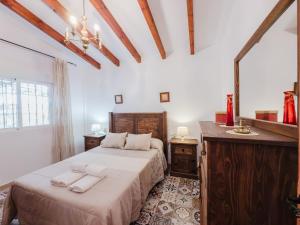 A bed or beds in a room at Cortijo Vélez