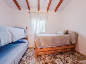A bed or beds in a room at Cortijo Vélez
