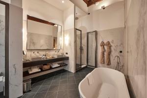 A bathroom at Puro Grand Hotel Még 37 kép