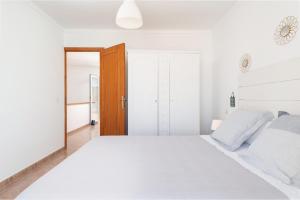 Posteľ alebo postele v izbe v ubytovaní Sunset Village