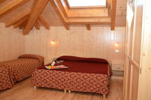 Postel nebo postele na pokoji v ubytování Hotel Corona