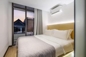 Postel nebo postele na pokoji v ubytování Amanda Hotel堆谷里酒店