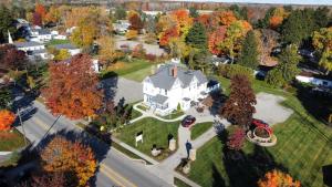 an overhead view of a large white house on a yard at Lake Huron Lodge in Lexington