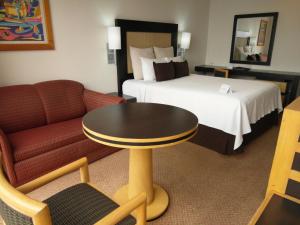 a hotel room with a bed and a table and a couch at Hotel Royal Reforma in Mexico City +31 photos