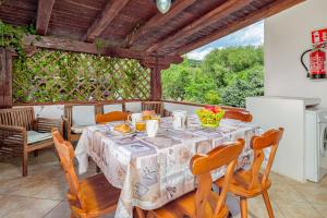 a dining room with a table and chairs at Orsa Maggiore Ottiolu in Porto Ottiolu +49 photos
