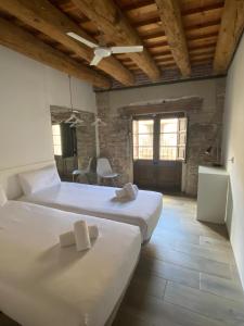 a bedroom with two beds and a ceiling at Barcelona Classic Palau Apartments in Barcelona +31 photos