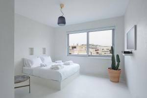Postel nebo postele na pokoji v ubytování Athens Penthouse Aparthotel