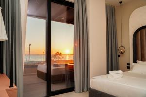 a hotel room with a view of the ocean at Diamar Suites in Durrës