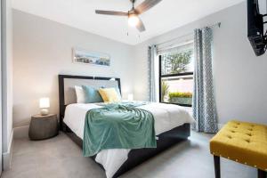 a bedroom with a bed and a window at 3mins2Beach, Pool, FencedYard, Bikes, Patio, Office in Bonita Springs +55 photos