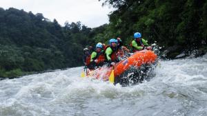 a group of people in a raft on a river at Cabaña "Los Cedros", Sumak Cabañas in Baeza