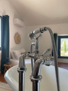 Postel nebo postele na pokoji v ubytování Maison d'hôtes la Doma Venterol chambres & SPA