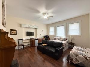 a living room with a bed and a couch at Lake Huron Lodge in Lexington