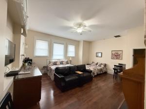 a living room with a couch and a table at Lake Huron Lodge in Lexington +15 photos