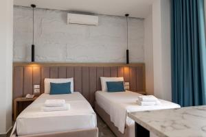 Voodi või voodid majutusasutuse Monel Hotel toas