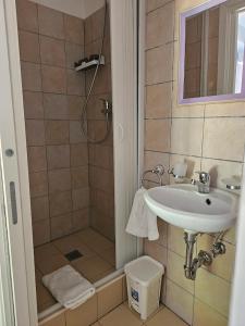 a bathroom with a sink and a shower at Blue Tide - Tropea in Tropea +25 photos