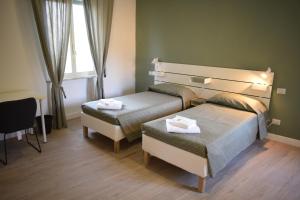 Postel nebo postele na pokoji v ubytování Residenza Cimone