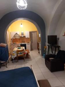 a living room with a couch and a kitchen at Modern Studio in Catania with Air Conditioning in Catania