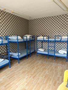 Postel nebo postele na pokoji v ubytování Comebackpackers