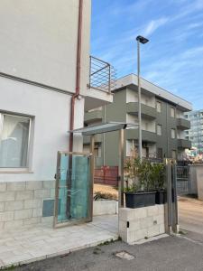 a building with a glass door in front of it at Wave House in Montesilvano