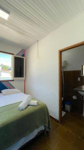Postel nebo postele na pokoji v ubytování Hospedaria São Jorge