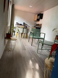 a living room with tables and chairs and a bird on a table at Coral Stay Bahia Drake in Drake
