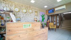 a shop with a counter and clocks on the wall at La Cactus Boutique Hotel in Antalya