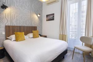 Postel nebo postele na pokoji v ubytování Best Western Plus Hôtel Brice Garden Nice