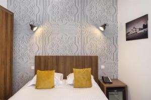 Postel nebo postele na pokoji v ubytování Best Western Plus Hôtel Brice Garden Nice