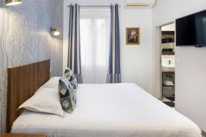 Postel nebo postele na pokoji v ubytování Best Western Plus Hôtel Brice Garden Nice